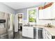 Well-appointed kitchen with stainless steel appliances, granite countertops, and white cabinetry at 4917 N Park Ave, Indianapolis, IN 46205