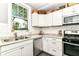 Updated kitchen with stainless steel appliances, granite countertops, and plenty of storage at 4917 N Park Ave, Indianapolis, IN 46205
