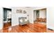 Spacious living room with hardwood floors and view to dining area at 4917 N Park Ave, Indianapolis, IN 46205