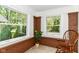 Bright sun room with brick accents, large windows, and a peaceful atmosphere at 4917 N Park Ave, Indianapolis, IN 46205