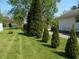 Expansive backyard featuring lush lawn and mature trees, perfect for outdoor activities at 4927 Mathews Ave, Indianapolis, IN 46227