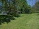 Spacious backyard with mature trees offering plenty of shade and privacy at 4927 Mathews Ave, Indianapolis, IN 46227