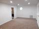 Finished basement featuring carpet, recessed lighting, octagonal window, and brick fireplace at 4927 Mathews Ave, Indianapolis, IN 46227