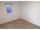 The bedroom features light colored walls and neutral carpeting at 4927 Mathews Ave, Indianapolis, IN 46227