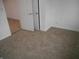Cozy bedroom features neutral carpet and a closet with white doors at 4927 Mathews Ave, Indianapolis, IN 46227