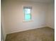 Bright bedroom with natural light and neutral carpeting at 4927 Mathews Ave, Indianapolis, IN 46227