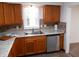 Charming kitchen featuring granite countertops, backsplash and stainless steel dishwasher at 4927 Mathews Ave, Indianapolis, IN 46227