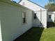 Exterior view showing the white siding, windows, and landscaped yard at 4927 Mathews Ave, Indianapolis, IN 46227