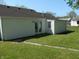 Rear exterior view of home with French doors and manicured lawn at 4927 Mathews Ave, Indianapolis, IN 46227
