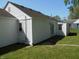 Exterior view highlighting the rear of the house with siding and well-kept lawn at 4927 Mathews Ave, Indianapolis, IN 46227
