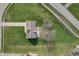 Overhead view of a home with a large, well-kept lawn, mature trees, and a paved driveway at 4940 Sundance Trl, Indianapolis, IN 46239