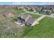 Aerial view showcasing a spacious backyard with a patio, set against a neighborhood backdrop at 4940 Sundance Trl, Indianapolis, IN 46239