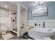 Elegant bathroom with a freestanding tub, walk-in shower, and stylish fixtures at 4940 Sundance Trl, Indianapolis, IN 46239