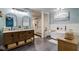 Modern bathroom with a double vanity, soaking tub, and a glass-enclosed shower at 4940 Sundance Trl, Indianapolis, IN 46239