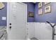 Convenient dog wash station with tile surround, hand sprayer, and pet portraits at 4940 Sundance Trl, Indianapolis, IN 46239