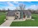 Beautiful home with a brick and siding facade, complemented by a green lawn and inviting driveway at 4940 Sundance Trl, Indianapolis, IN 46239