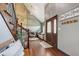 Welcoming foyer with hardwood floors, a staircase with iron railings, and views into the living area at 4940 Sundance Trl, Indianapolis, IN 46239