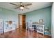 Home office featuring hardwood floors, natural light and a desk at 4940 Sundance Trl, Indianapolis, IN 46239