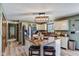 Well-lit kitchen featuring stainless steel appliances, wood countertops, and farmhouse-style cabinetry at 4940 Sundance Trl, Indianapolis, IN 46239