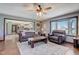 Comfortable living room with brown leather sofa, matching armchair, and rustic wood coffee table at 4940 Sundance Trl, Indianapolis, IN 46239