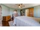 Inviting main bedroom with hardwood floors, a ceiling fan, and stylish decor at 4940 Sundance Trl, Indianapolis, IN 46239