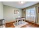 Bright home office with hardwood floors, large window, and a cozy rug at 4940 Sundance Trl, Indianapolis, IN 46239