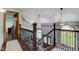 Beautiful staircase with dark wood railings, modern light fixtures, and an open design at 4940 Sundance Trl, Indianapolis, IN 46239