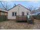 Exterior back of house featuring a wood deck and door leading into house at 5080 Norwaldo Ave, Indianapolis, IN 46205