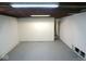 Unfinished basement with concrete floor and exposed ceiling offers potential for customization at 5080 Norwaldo Ave, Indianapolis, IN 46205