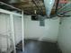 Unfinished basement featuring open ceiling with exposed pipes and electrical at 5080 Norwaldo Ave, Indianapolis, IN 46205