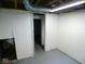 A functional basement with white walls and visible ceiling ductwork at 5080 Norwaldo Ave, Indianapolis, IN 46205