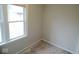 A corner bedroom with bare floors and a large window letting in ample light at 5080 Norwaldo Ave, Indianapolis, IN 46205