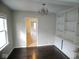 Inviting dining room with built-in shelving and classic chandelier lighting at 5080 Norwaldo Ave, Indianapolis, IN 46205