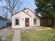 Charming single-story home featuring a cozy front porch and neutral siding at 5080 Norwaldo Ave, Indianapolis, IN 46205