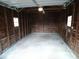 Inside of detached garage with concrete floor and weathered wood walls at 5080 Norwaldo Ave, Indianapolis, IN 46205