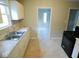 Kitchen features stainless steel sink, ample counter space and a black oven at 5080 Norwaldo Ave, Indianapolis, IN 46205