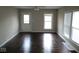 Bright living room showcasing hardwood floors and natural light from multiple windows at 5080 Norwaldo Ave, Indianapolis, IN 46205