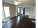 Open-concept living area featuring hardwood floors, neutral walls, and ceiling fan at 5080 Norwaldo Ave, Indianapolis, IN 46205