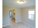 Bright room with light walls and tile floors at 5080 Norwaldo Ave, Indianapolis, IN 46205