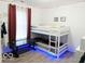 This bedroom features a bunk bed with LED lighting and a black table at 5411 Cliff Ridge Dr, Indianapolis, IN 46217