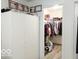 Walk-in closet with ample storage, featuring clothing racks, shelving, and wooden floors for organization and convenience at 5411 Cliff Ridge Dr, Indianapolis, IN 46217