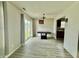 Bright dining area featuring modern flooring and a sliding glass door, seamlessly connecting indoor and outdoor spaces at 5411 Cliff Ridge Dr, Indianapolis, IN 46217