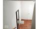 View of the entryway with wood flooring, textured walls, and natural lighting at 5411 Cliff Ridge Dr, Indianapolis, IN 46217