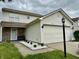 Charming two-story home featuring vinyl siding, a two-car garage, and a well-maintained front yard at 5411 Cliff Ridge Dr, Indianapolis, IN 46217