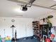 Garage with ample storage options, including shelving and wall-mounted bike racks at 5411 Cliff Ridge Dr, Indianapolis, IN 46217