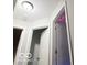 Hallway with white trim door frames and neutral-toned walls provides passage between rooms at 5411 Cliff Ridge Dr, Indianapolis, IN 46217