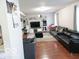 Spacious living room featuring hardwood floors, sofas and entertainment center at 5411 Cliff Ridge Dr, Indianapolis, IN 46217