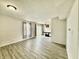 Open-concept living and dining areas with modern flooring and ample natural light create an inviting space at 5411 Cliff Ridge Dr, Indianapolis, IN 46217