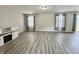 A spacious living room with modern floors and light-colored walls, offering a bright and inviting atmosphere at 5411 Cliff Ridge Dr, Indianapolis, IN 46217