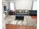 Cozy living room featuring sofas and hardwood floors at 5411 Cliff Ridge Dr, Indianapolis, IN 46217